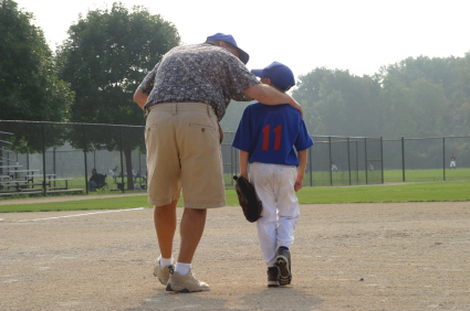 Image of Youth Baseball player and parent